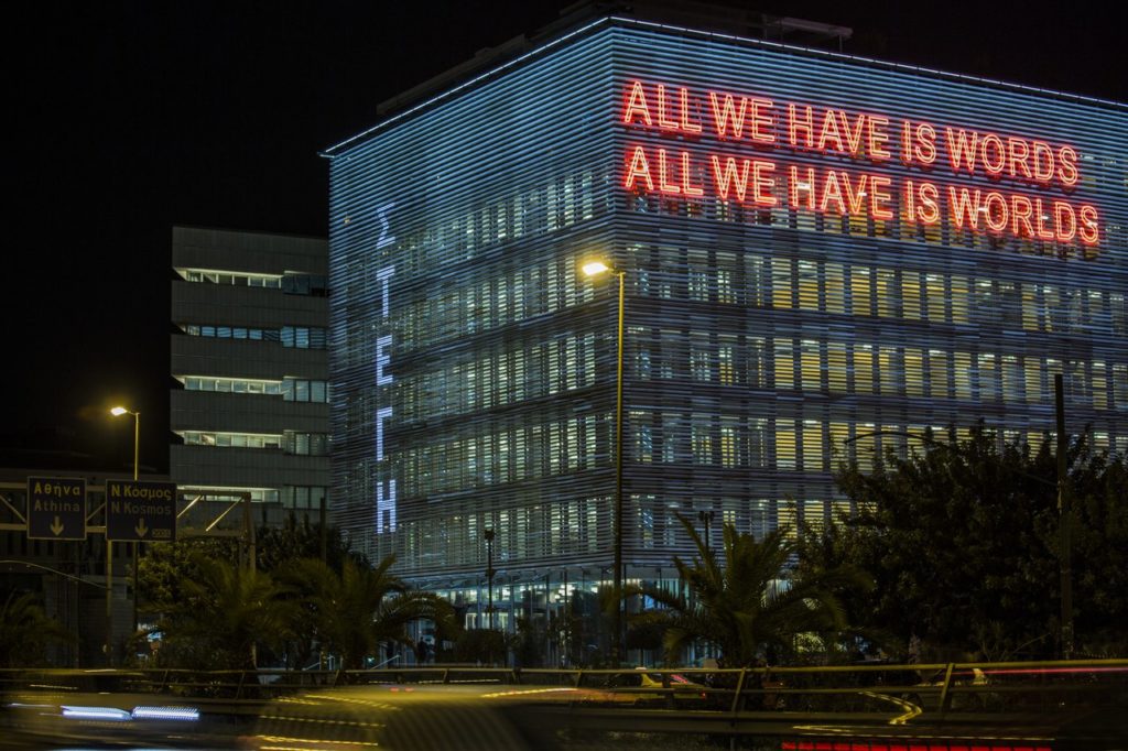 Outside of building with large neon writing
