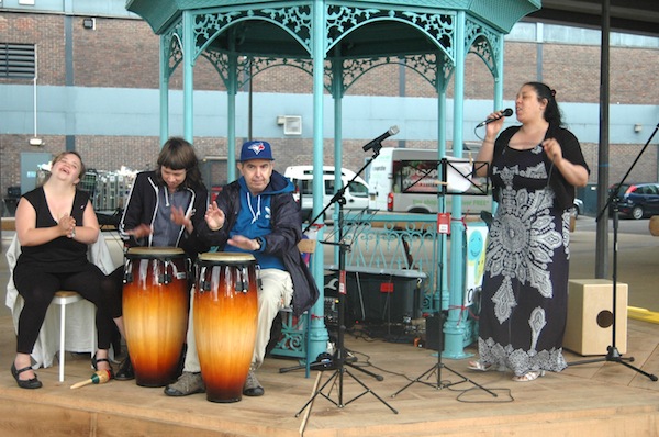 4 musicians on a band stand