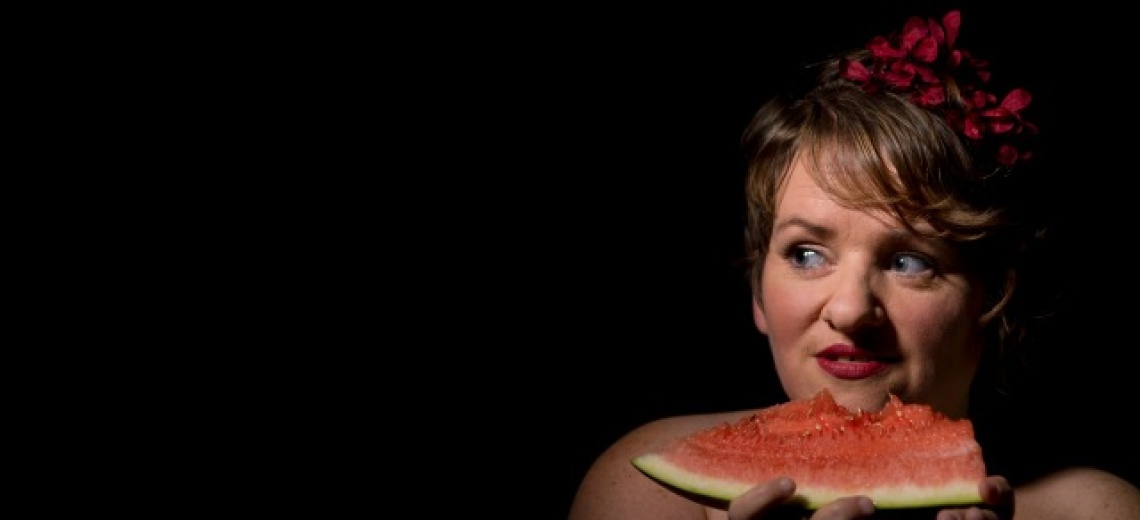 Woman eating a slice of watermelon