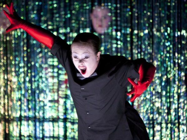 Female performer with red velvet gloves