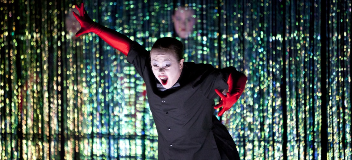 Female performer with red velvet gloves