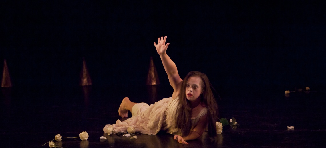 Female performer lying on stage
