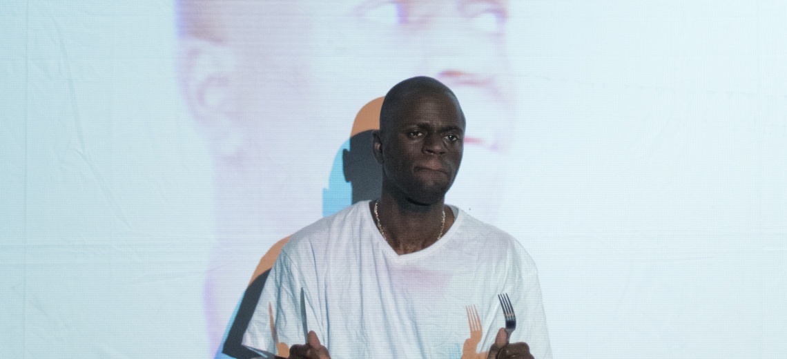 Man standing in front of projection