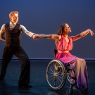 Male and female dance duet, female is a wheelchair users