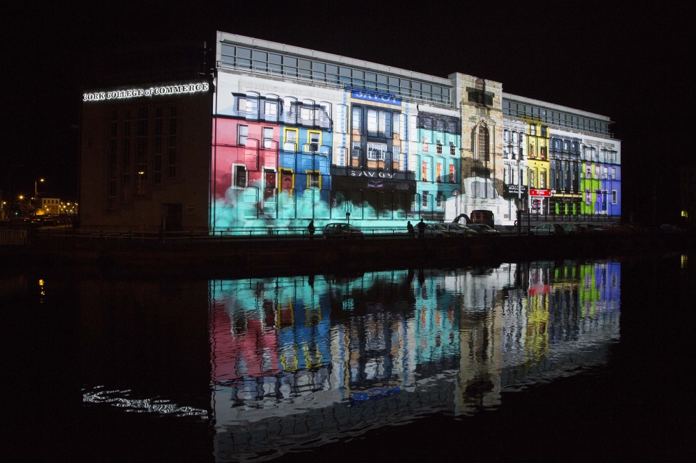 photo of a large building in Cork with a large multimedia projection on the side