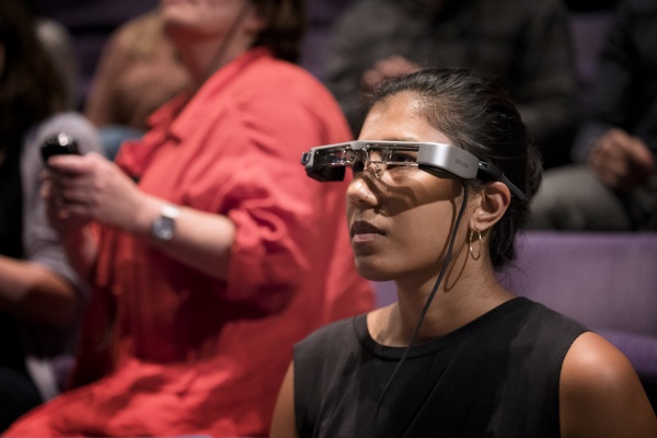 Woman wearing captioning glasses