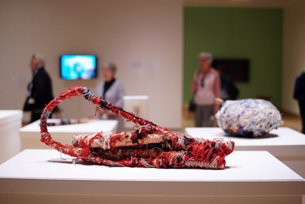 Photograph of red fabric sculpture ion a plinth