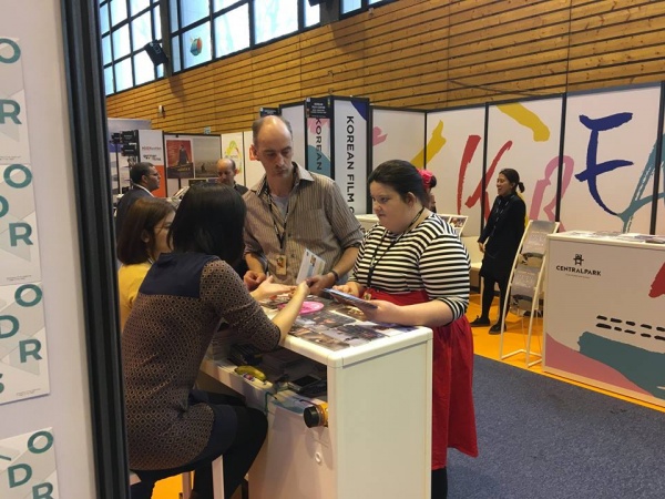 Becky Bruzas and Matthew Hellet at a presentation booth at Clermont Ferrand Film