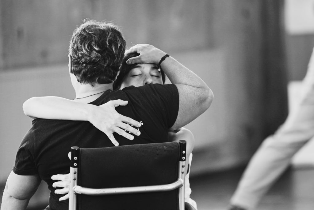 Greek dancer Irini Kourouvani duets with another dancer in an embrace