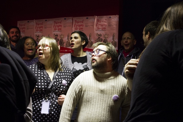 Photograph of a group of people singing