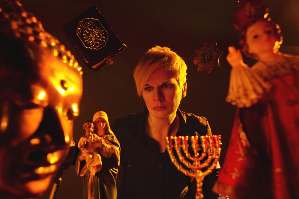 Photograph of Claire Cunningham with religious icons around her