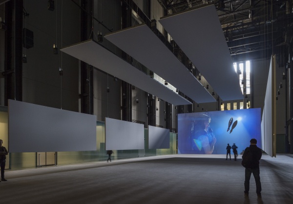Installation view in Tate's Turbine hall showing a huge projection