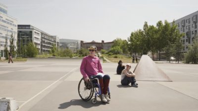 Wheelchair user sitting in a skatepark