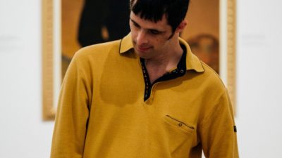 Learning disabled man with yellow jumper