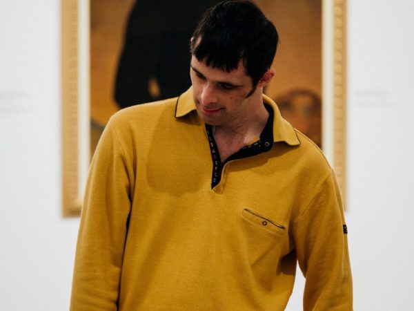 Learning disabled man with yellow jumper