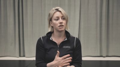 White blonde female wheelchair user talks during an interview