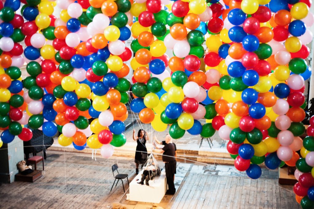 Installation of an inside of a church filled with balloons