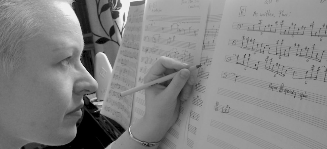 Woman composing at piano