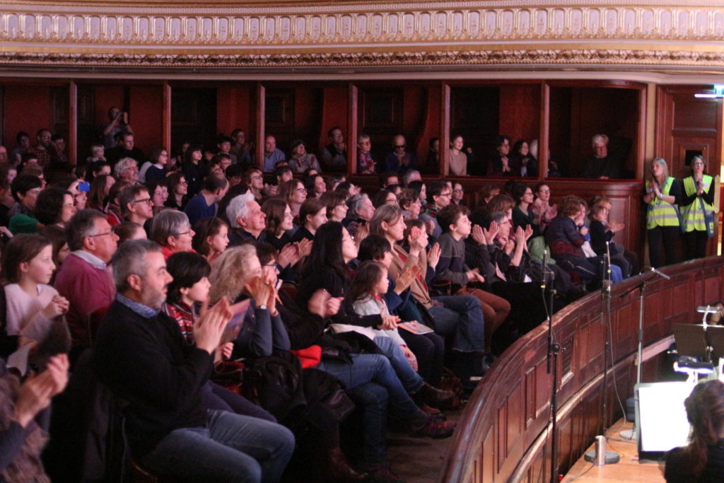 A packed crowd at a opera performance