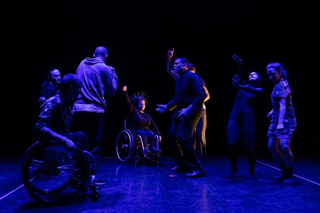 Panoramic view of the performers of 'Do Robots have emotions?' performing on the stage