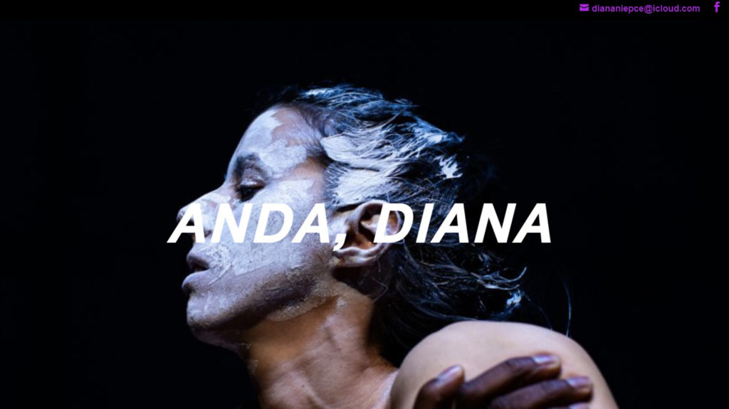 The image takes only the performer's face, from the side, covered in a white chalk-like material. The dark hair is tied up.