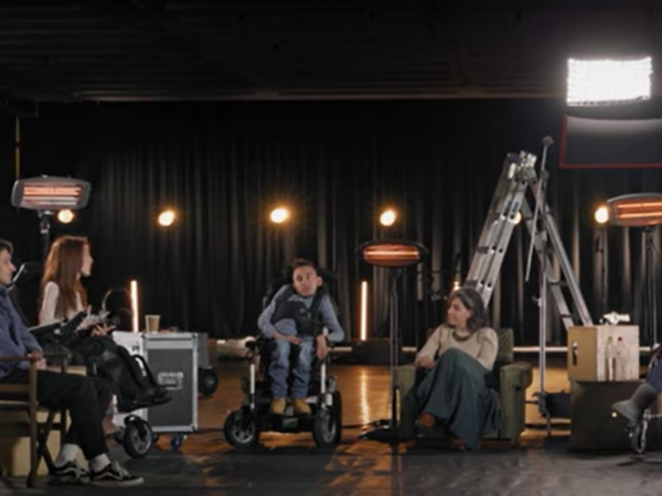A group of disabled artists on stage discuss ideas