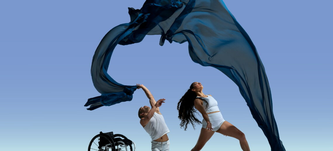 ALT Text: JanpiStar gracefully falls to the floor from their wheelchair as they throw a billowing blue piece of fabric in the air. Zara Anwar watches the fabric cascade above her as she leans back in a lunge. Both dancers wear all white against a blue gradient background. 